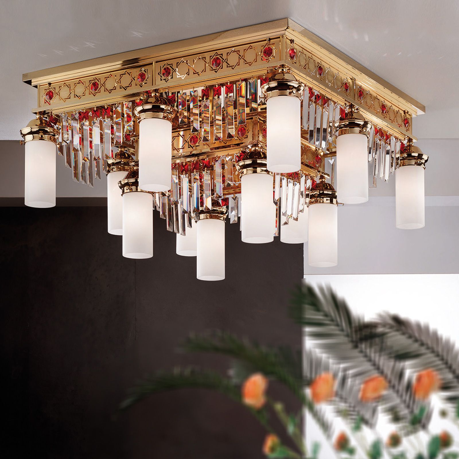 Ceiling chandelier ORIONtal, 8+4-flames, gold, with red crystal prisms