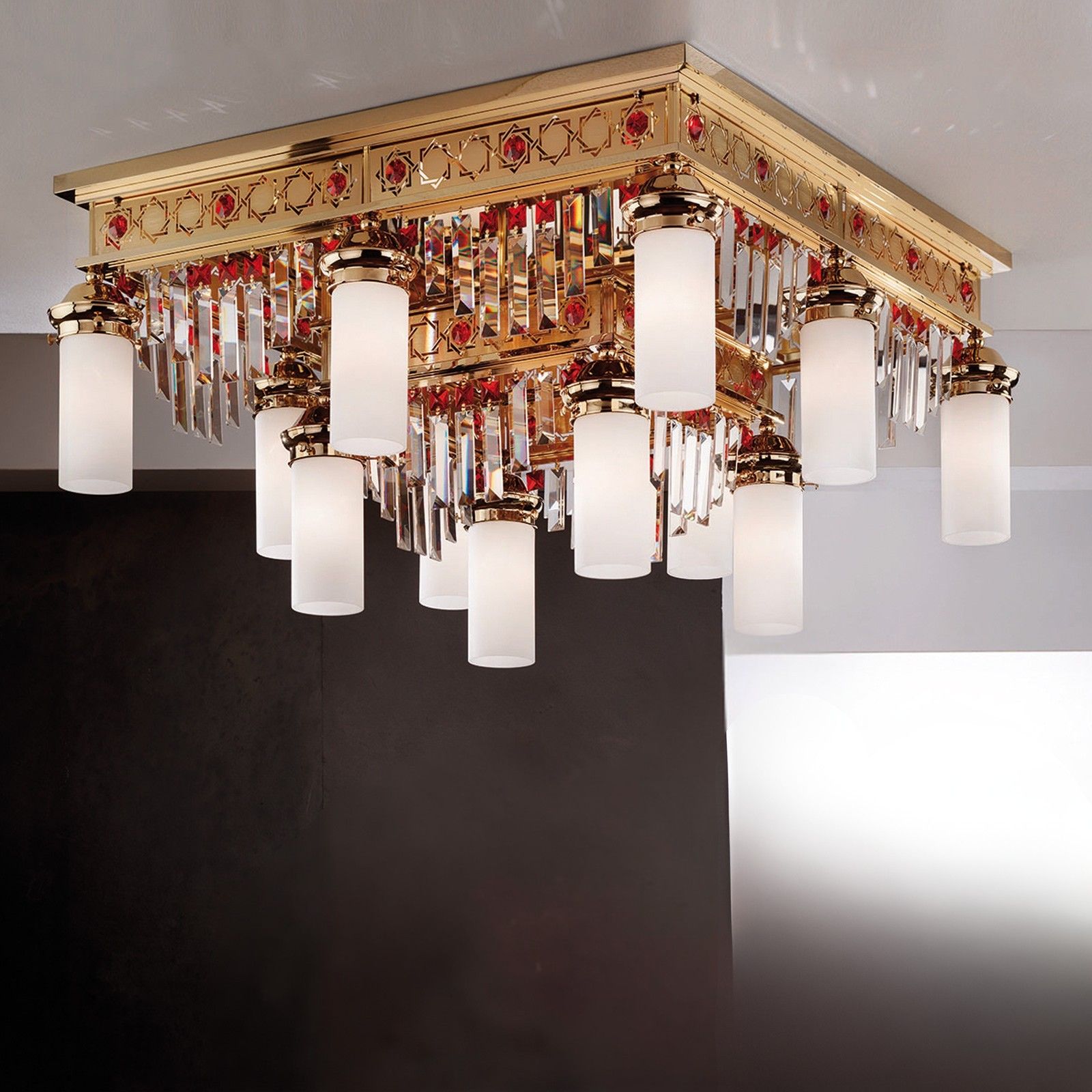 Ceiling chandelier ORIONtal, 8+4-flames, gold, with red crystal prisms