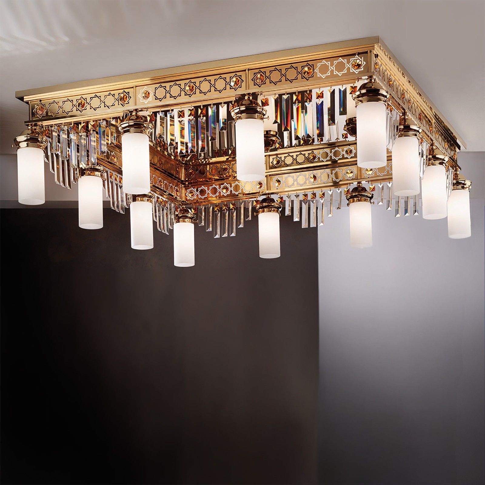 Ceiling chandelier ORIONtal, 12-flames, gold, with topaz-coloured crystal prisms